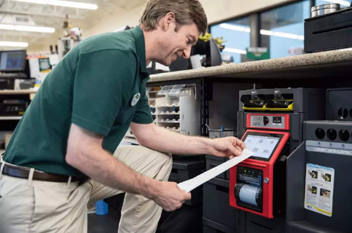 Convenience store operator views deposit slip from Titan smart safe