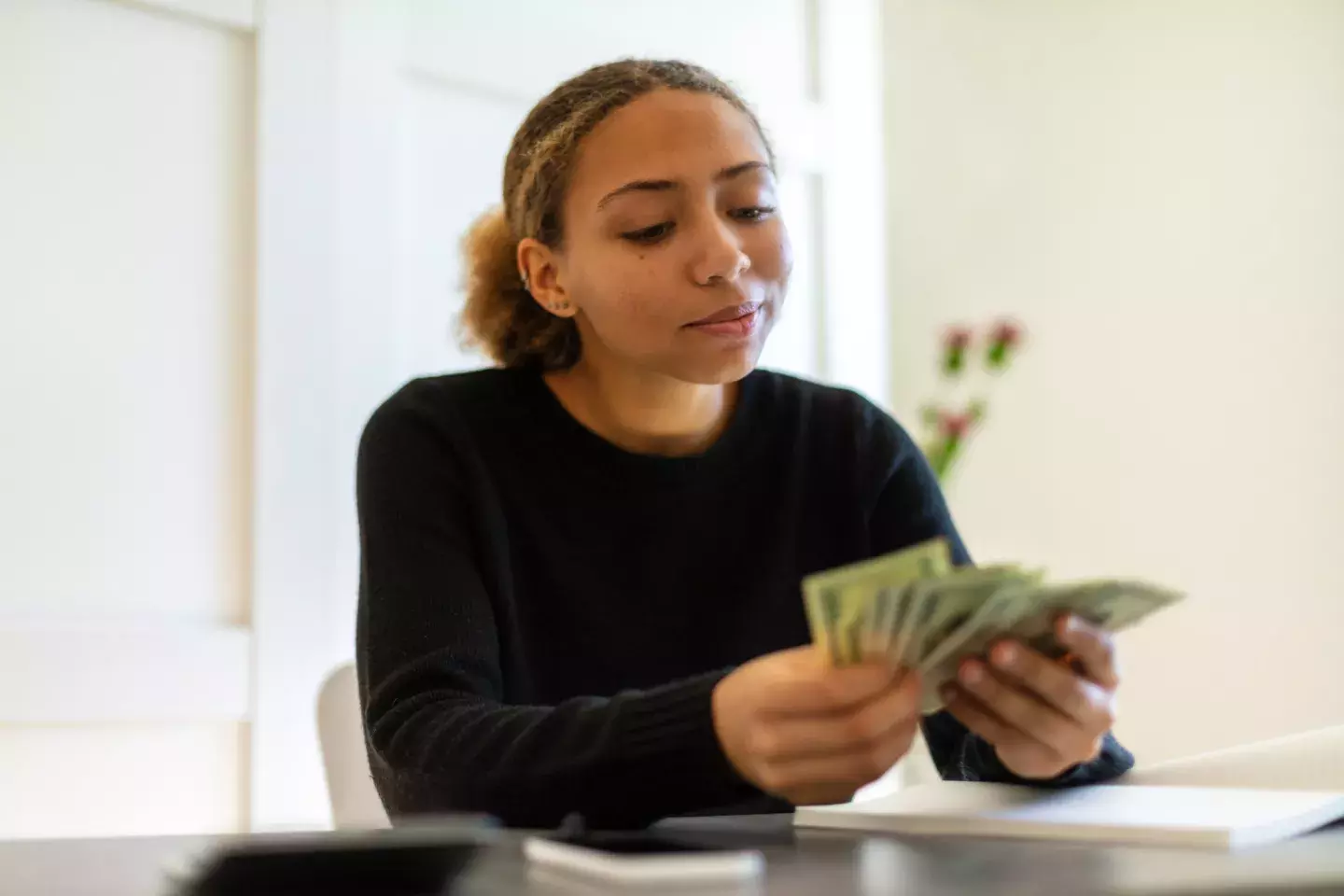 Woman Holding Cash
